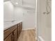 Bathroom with wood cabinets, shower, sink, and tile flooring at 4135 Shoshone Valley Rd, Marietta, GA 30068