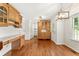 Bright kitchen/dining area featuring hardwood floors, custom cabinetry and modern lighting fixtures at 4135 Shoshone Valley Rd, Marietta, GA 30068