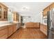 Spacious kitchen featuring wood cabinets, center island, and stainless steel refrigerator at 4135 Shoshone Valley Rd, Marietta, GA 30068