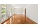 Expansive living room featuring hardwood flooring, natural light, and neutral paint at 4135 Shoshone Valley Rd, Marietta, GA 30068