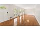 Bright, spacious living room with gleaming hardwood floors and large windows at 4135 Shoshone Valley Rd, Marietta, GA 30068