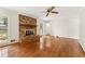 Cozy living room featuring a brick fireplace and hardwood floors, offering a comfortable living space at 4135 Shoshone Valley Rd, Marietta, GA 30068