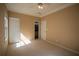 Neutral bedroom offering carpet flooring, ample closet space, and natural light at 1074 Frog Leap Nw Trl, Kennesaw, GA 30152