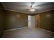 Neutral carpeted bedroom with overhead lighting and crown molding, freshly painted with neutral colors at 1074 Frog Leap Nw Trl, Kennesaw, GA 30152