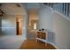 Inviting foyer with hardwood floors, staircase, and decoratively painted cabinet at 1074 Frog Leap Nw Trl, Kennesaw, GA 30152
