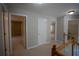 Upstairs hallway connecting bedrooms and closets with neutral walls and carpet flooring at 1074 Frog Leap Nw Trl, Kennesaw, GA 30152