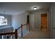 Upstairs hallway offers easy access to the bedrooms and bathroom, illuminated by modern lighting at 1074 Frog Leap Nw Trl, Kennesaw, GA 30152