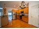 Spacious kitchen boasts stainless appliances, hardwood floors and view to open living space at 1074 Frog Leap Nw Trl, Kennesaw, GA 30152