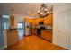Well-appointed kitchen with granite countertops, stainless steel appliances, and hardwood floors at 1074 Frog Leap Nw Trl, Kennesaw, GA 30152