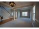 Spacious living room featuring neutral tones, hardwood floors, elegant trim, and natural light, perfect for gatherings at 1074 Frog Leap Nw Trl, Kennesaw, GA 30152