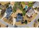 Aerial view of a neighborhood with mature trees and landscaping surrounding each home and backyard pool at 5124 Parkwood Oaks Ln, Smyrna, GA 30126