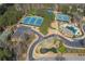 Aerial view showcasing community amenities, including tennis courts, pool, and landscaping at 5124 Parkwood Oaks Ln, Smyrna, GA 30126