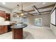 Finished basement with a bar, granite countertops, coffered ceilings, and access to the outdoors at 5124 Parkwood Oaks Ln, Smyrna, GA 30126