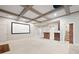 A finished basement with coffered ceilings, a projector screen, and a kitchenette at 5124 Parkwood Oaks Ln, Smyrna, GA 30126