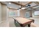Basement area with a pool table, coffered ceilings, and access to the outside at 5124 Parkwood Oaks Ln, Smyrna, GA 30126