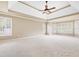 Spacious bedroom with tray ceiling, large windows offering plenty of natural light, and neutral carpeting at 5124 Parkwood Oaks Ln, Smyrna, GA 30126