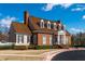Attractive exterior of the clubhouse with brick facade, columns, and manicured landscaping at 5124 Parkwood Oaks Ln, Smyrna, GA 30126