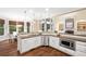 Gourmet kitchen featuring white cabinetry, stainless steel appliances, and hardwood floors at 5124 Parkwood Oaks Ln, Smyrna, GA 30126