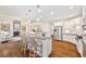 Open concept kitchen with a large island, stainless steel appliances, and hardwood floors at 5124 Parkwood Oaks Ln, Smyrna, GA 30126