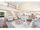 Open-concept living room with high ceilings, hardwood floors, and large windows for natural light at 5124 Parkwood Oaks Ln, Smyrna, GA 30126