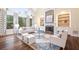 Bright living room featuring a fireplace, built-in shelving, and large windows at 5124 Parkwood Oaks Ln, Smyrna, GA 30126