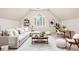 Spacious living area featuring a vaulted ceiling, modern furniture, and a neutral color palette at 5124 Parkwood Oaks Ln, Smyrna, GA 30126