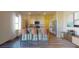 Modern kitchen featuring an island with barstool seating, granite countertops, and stainless steel appliances at 196 Silverton Dr, Dacula, GA 30019