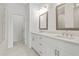 Bathroom with double sink vanity, framed mirrors, and tile flooring at 2340 Edgar Park Pl # 97, Duluth, GA 30096