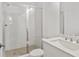 Bathroom featuring a glass shower, white tiles, and a sink at 2340 Edgar Park Pl # 97, Duluth, GA 30096
