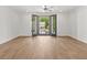 Primary bedroom features hardwood floors and natural light, with access to a balcony at 2340 Edgar Park Pl # 97, Duluth, GA 30096