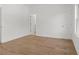 Neutral bedroom with hardwood floors and multiple doors, offering versatile layout options at 2340 Edgar Park Pl # 97, Duluth, GA 30096