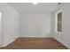 Well-lit bedroom featuring hardwood floors and a window at 2340 Edgar Park Pl # 97, Duluth, GA 30096