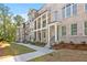 Well-maintained townhome complex with brick facades, covered entryways, and landscaped lawns at 2340 Edgar Park Pl # 97, Duluth, GA 30096