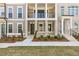 Beautiful townhome with brick and siding, covered porch, and manicured landscaping at 2340 Edgar Park Pl # 97, Duluth, GA 30096