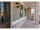 Charming covered front porch with brick accents, exterior lighting, and a welcoming entryway at 2340 Edgar Park Pl # 97, Duluth, GA 30096