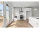 Bright kitchen features white cabinetry, stainless steel appliances, and hardwood flooring at 2340 Edgar Park Pl # 97, Duluth, GA 30096