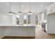 Bright kitchen with white cabinets, stainless steel appliances, and large island at 2340 Edgar Park Pl # 97, Duluth, GA 30096