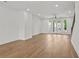 Spacious living room boasting natural light, hardwood floors, and balcony access at 2340 Edgar Park Pl # 97, Duluth, GA 30096