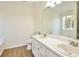 Bathroom with a bathtub with a shower and double sinks with vanities at 4785 Beaver Rd, Loganville, GA 30052