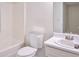 Bathroom with a bathtub with a shower, a toilet and a sink with a vanity at 4785 Beaver Rd, Loganville, GA 30052