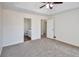 Bedroom with plush carpet and a doorway to the ensuite bathroom at 4785 Beaver Rd, Loganville, GA 30052