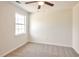 Bedroom with plush carpet, a ceiling fan, and a view from the window at 4785 Beaver Rd, Loganville, GA 30052