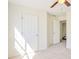 Bedroom with plush carpet and a doorway to the ensuite bathroom at 4785 Beaver Rd, Loganville, GA 30052