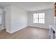 Dining room showcasing new floors, wainscoting, chandelier, and natural light at 4785 Beaver Rd, Loganville, GA 30052
