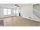 Spacious living room with new floors and staircase access to the upper level at 4785 Beaver Rd, Loganville, GA 30052
