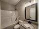 Full bathroom with a granite countertop vanity, and tub with shower at 490 Benson Meadows Dr, Dallas, GA 30157