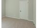 This bedroom features neutral carpet and a door, creating a serene and inviting space at 490 Benson Meadows Dr, Dallas, GA 30157