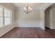 Dining room features hardwood floors, chandelier lighting, and white trim at 490 Benson Meadows Dr, Dallas, GA 30157