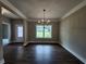 Dining room with chandelier, hardwood floors, and ample natural light at 490 Benson Meadows Dr, Dallas, GA 30157