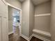 Home entryway with a built-in bench and coat rack at 490 Benson Meadows Dr, Dallas, GA 30157